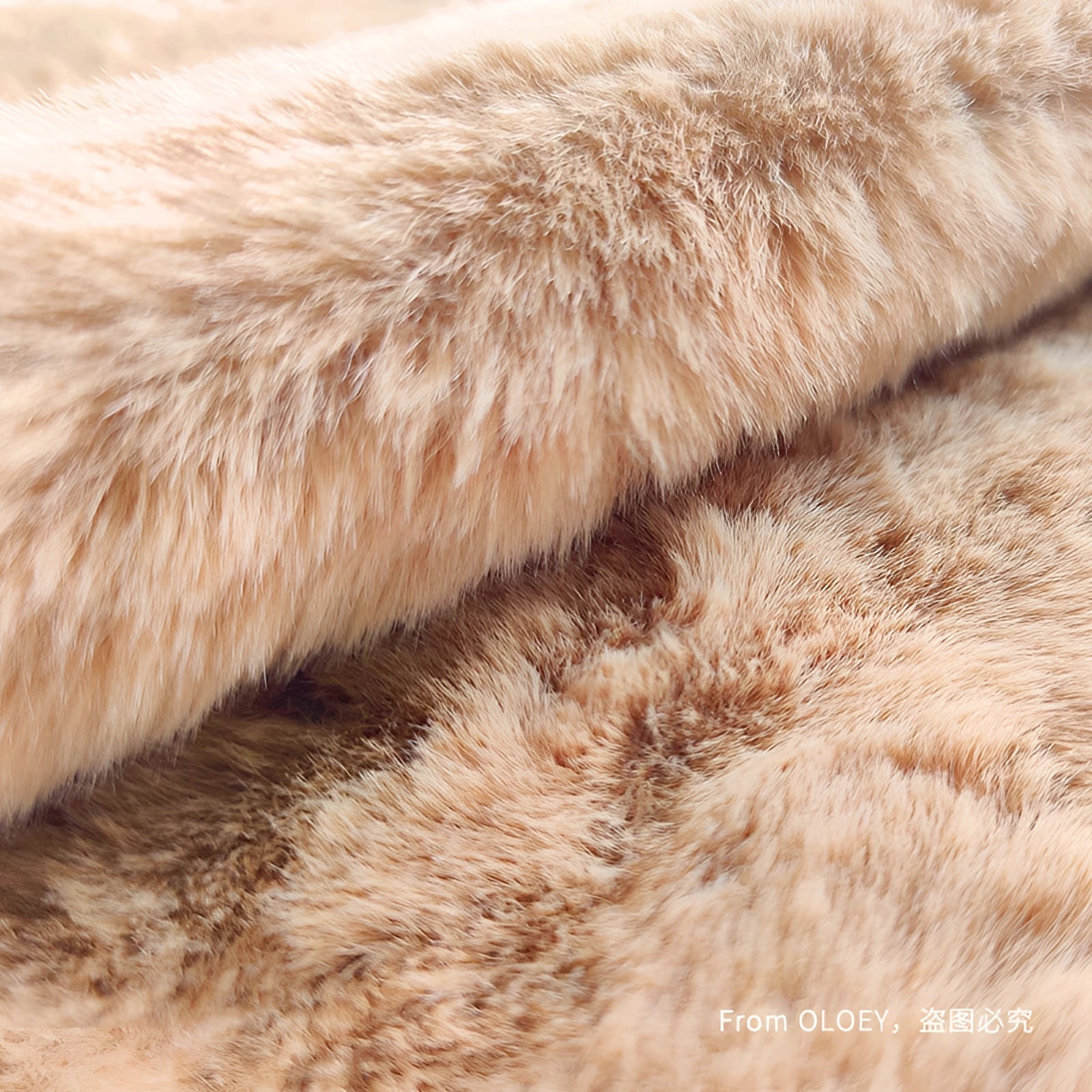 Luxurious faux fur blanket in a fawn and beige color, showcasing a plush and soft texture perfect for winter warmth and home decor.