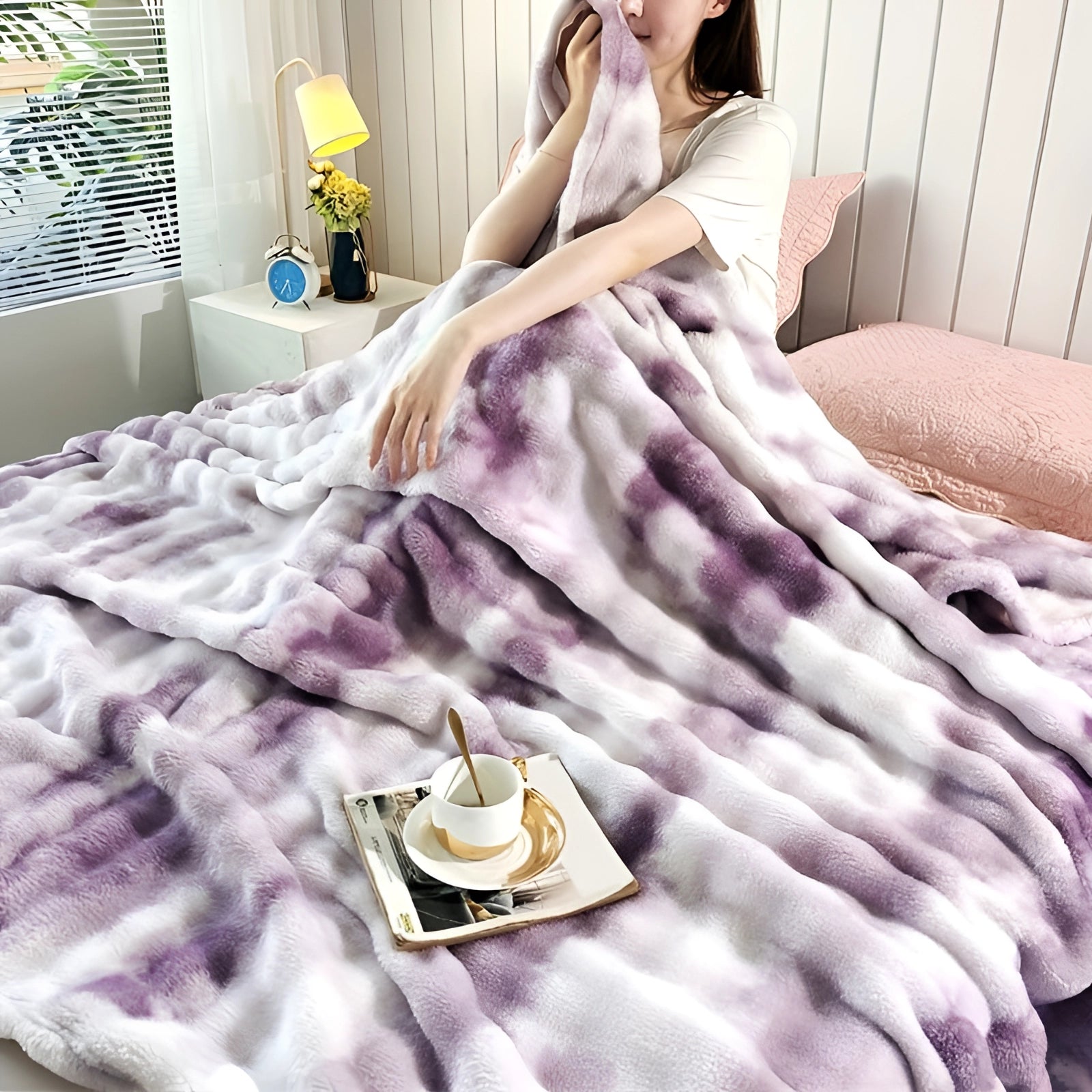 Purple luxury faux fur blanket draped over a sofa, showcasing its plush and cozy texture. The throw adds a touch of designer decor with its soft, inviting appearance. The large size of 200*230cm is suitable for creating a warm, comforting atmosphere in any interior setting.