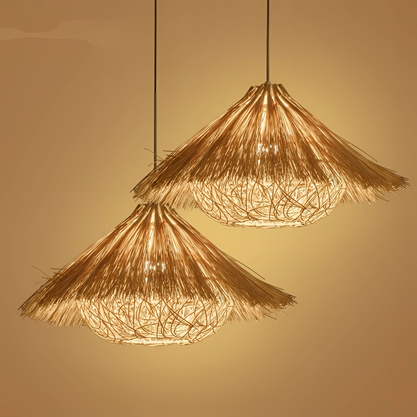 Luxury gold tassel chandelier with modern fringe design, featuring symmetric triangular shade elements, hanging from a ceiling.