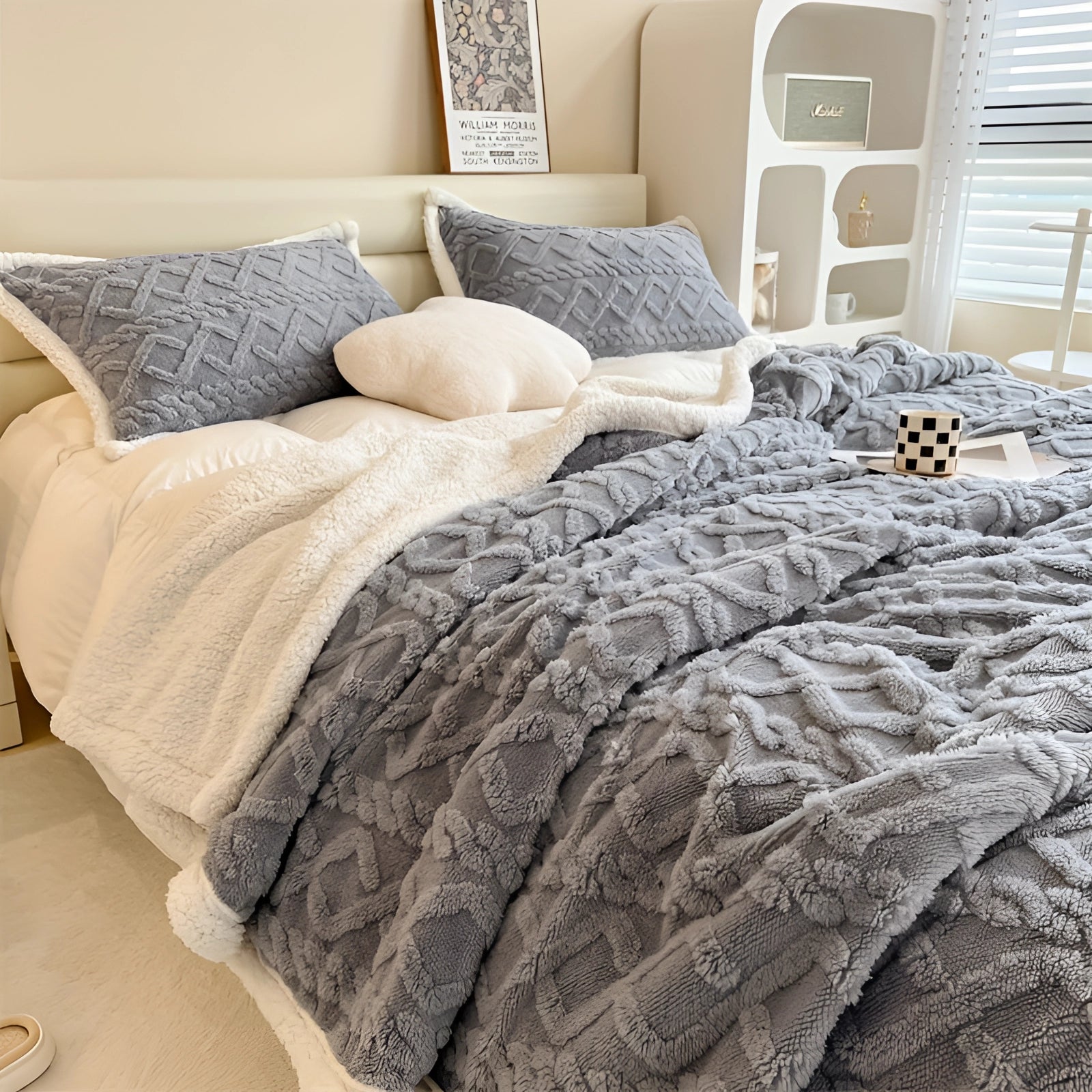 Luxury gray bedding set featuring a plush comforter and designer pillows arranged on a bed with a wooden bed frame, set in a stylishly designed bedroom interior.