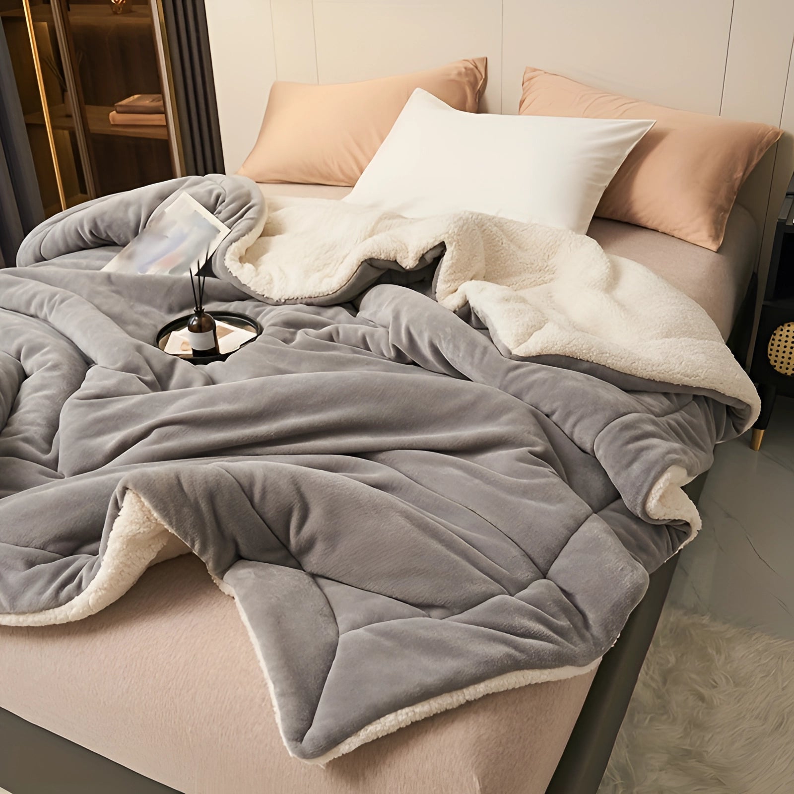 Luxury grey faux fur weighted blanket draped over a couch, providing cozy winter comfort in a home setting. The blanket is a large 200*230cm size, adding a touch of warmth and style to the living area.