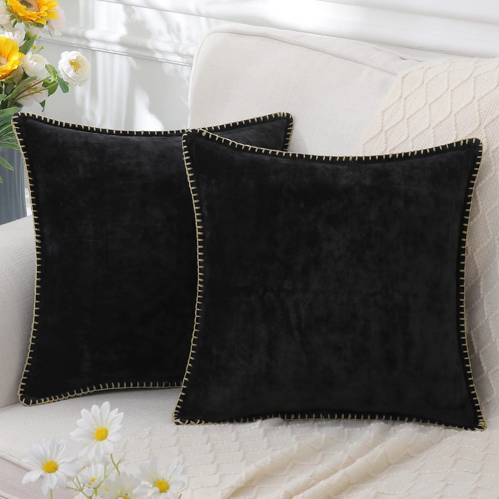 Elegant soft grey velvet throw pillows in a set of four, designed for home decor, shown in black variant.