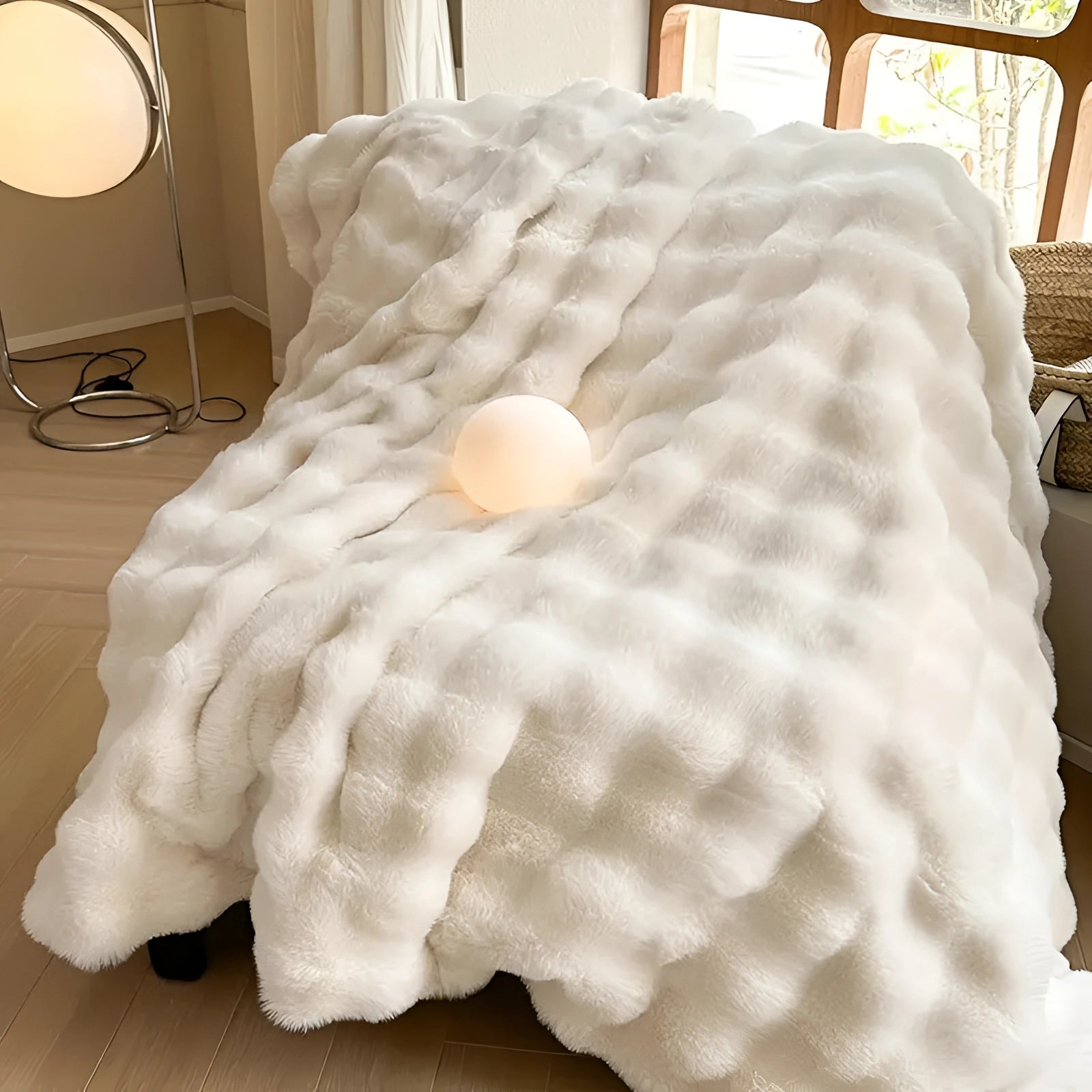 Luxurious chunky knit weighted blanket draped over a bed in a cozy setting, showcasing its thick texture and elegant design, perfect for adding warmth and style to any bedroom.