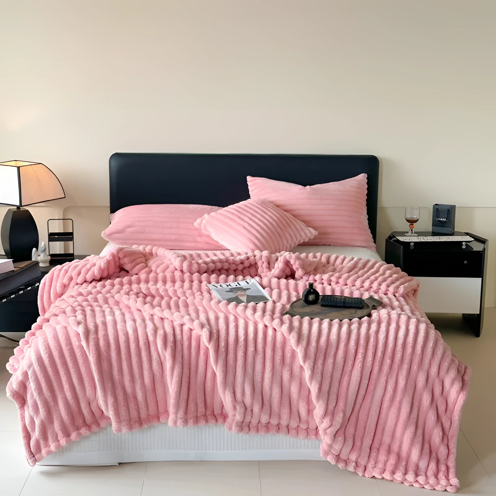 Luxury handmade chunky knit wool blanket in an oversized throw size of 230cm x 250cm, draped over a wooden bed frame with pillows, creating a cozy and inviting bedroom setting.