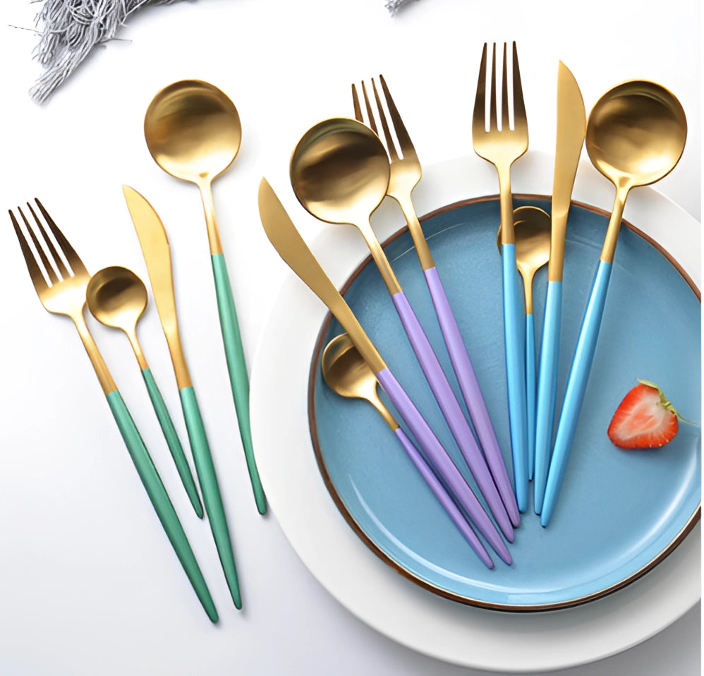 Luxury metallic finish cutlery set displayed on a dining table, featuring a fork alongside other tableware items such as a plate and drinkware.