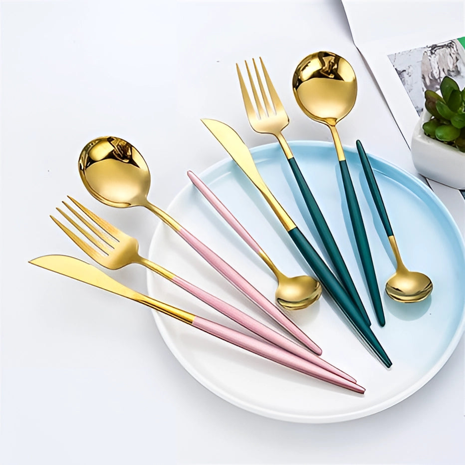 Luxury metallic finish cutlery set featuring stylish and durable forks, knives, and spoons arranged elegantly on a dining table, showcasing their sleek and modern design.