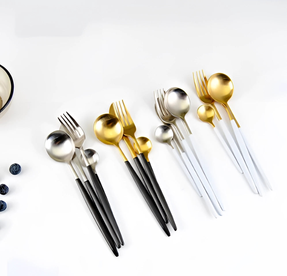 
A luxury metallic finish cutlery set featuring stylish and durable dining utensils, including forks, knives, and spoons, elegantly arranged on a sleek surface. The cutlery exhibits a shiny, reflective metal finish, perfect for enhancing dining experiences.