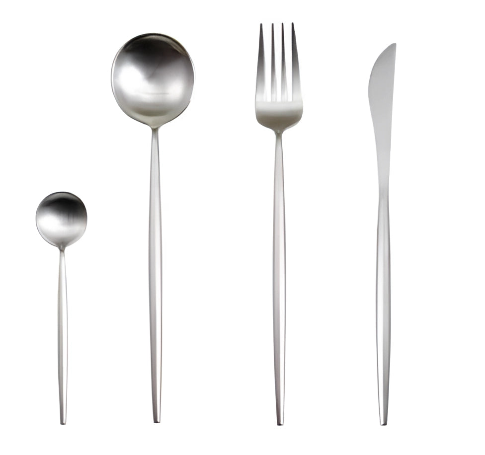 Silver metallic finish cutlery set featuring knives, forks, and spoons with a stylish and durable design, arranged on a dining table setting.