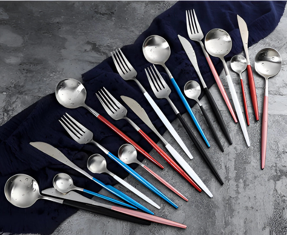 Luxury metallic finish cutlery set with sleek, contemporary design featuring a stylish and durable dining experience; the set includes a fork, knife, and spoon, all exhibiting a striking electric blue hue with shiny metal accents.