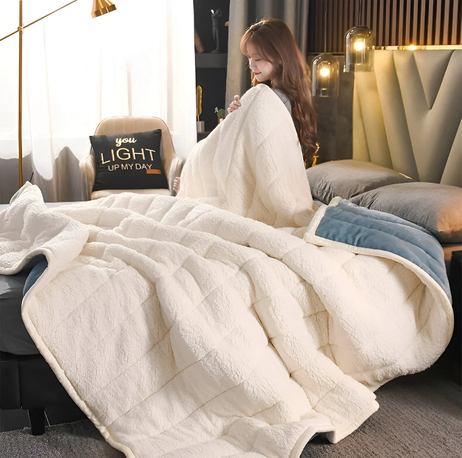 Luxurious cream-colored Sherpa blanket draped over a cozy bed, enhancing the warm and inviting interior design, with wooden bed frame and soft lighting from a nearby lamp.