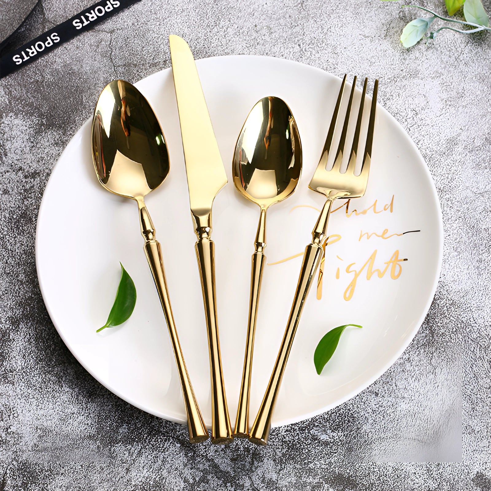 Luxury silver cutlery set featuring an elegant stainless steel fork placed on a white plate, ideal for sophisticated dining experiences.