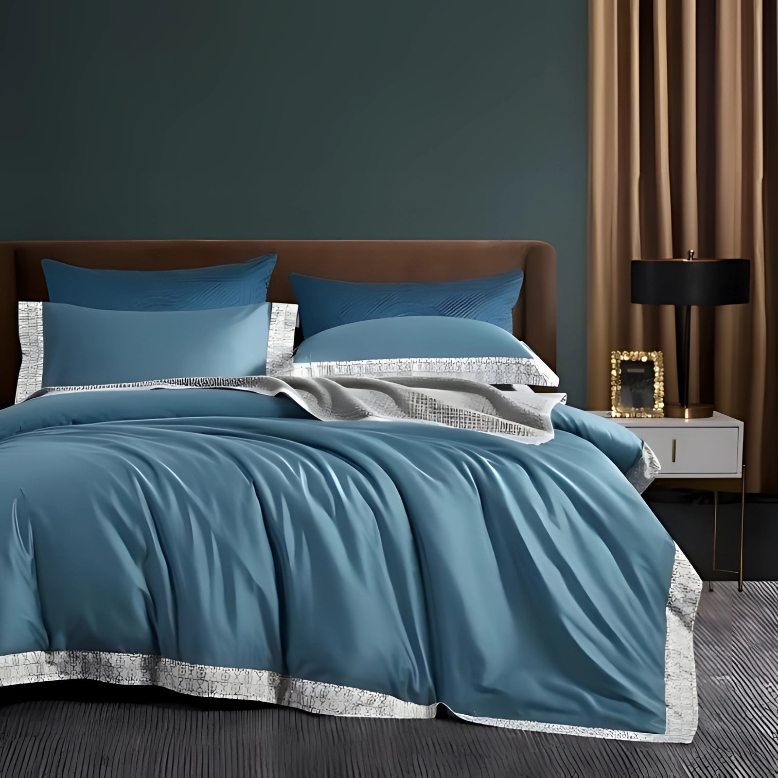 Luxurious teal bedding set displayed in a stylish bedroom with a king-sized bed featuring an elegant blue comforter and matching pillowcases, complemented by a wooden bed frame and decor that enhances the serene azure color scheme.