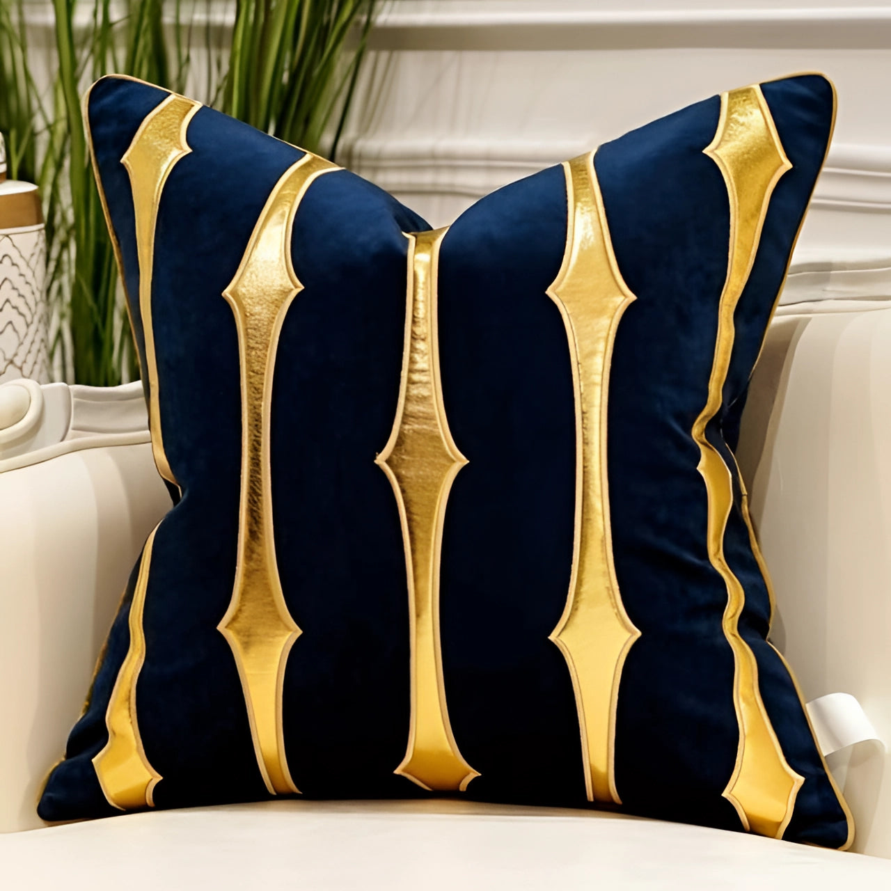 Luxury velvet throw pillow in a blue and gold color scheme featuring a geometric striped pattern and measuring 20 inches by 20 inches. The pillow is artistically designed with a plush texture, adding a touch of elegance and comfort to any living space.