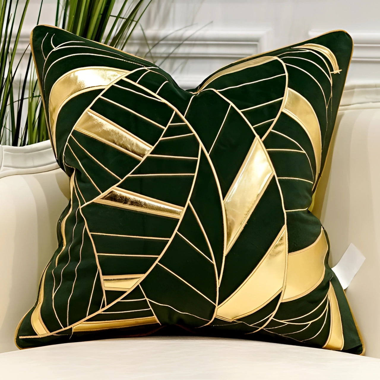 Luxury velvet throw pillow in green and gold with abstract geometric design, measuring 20 inches by 20 inches, displayed in an interior setting.