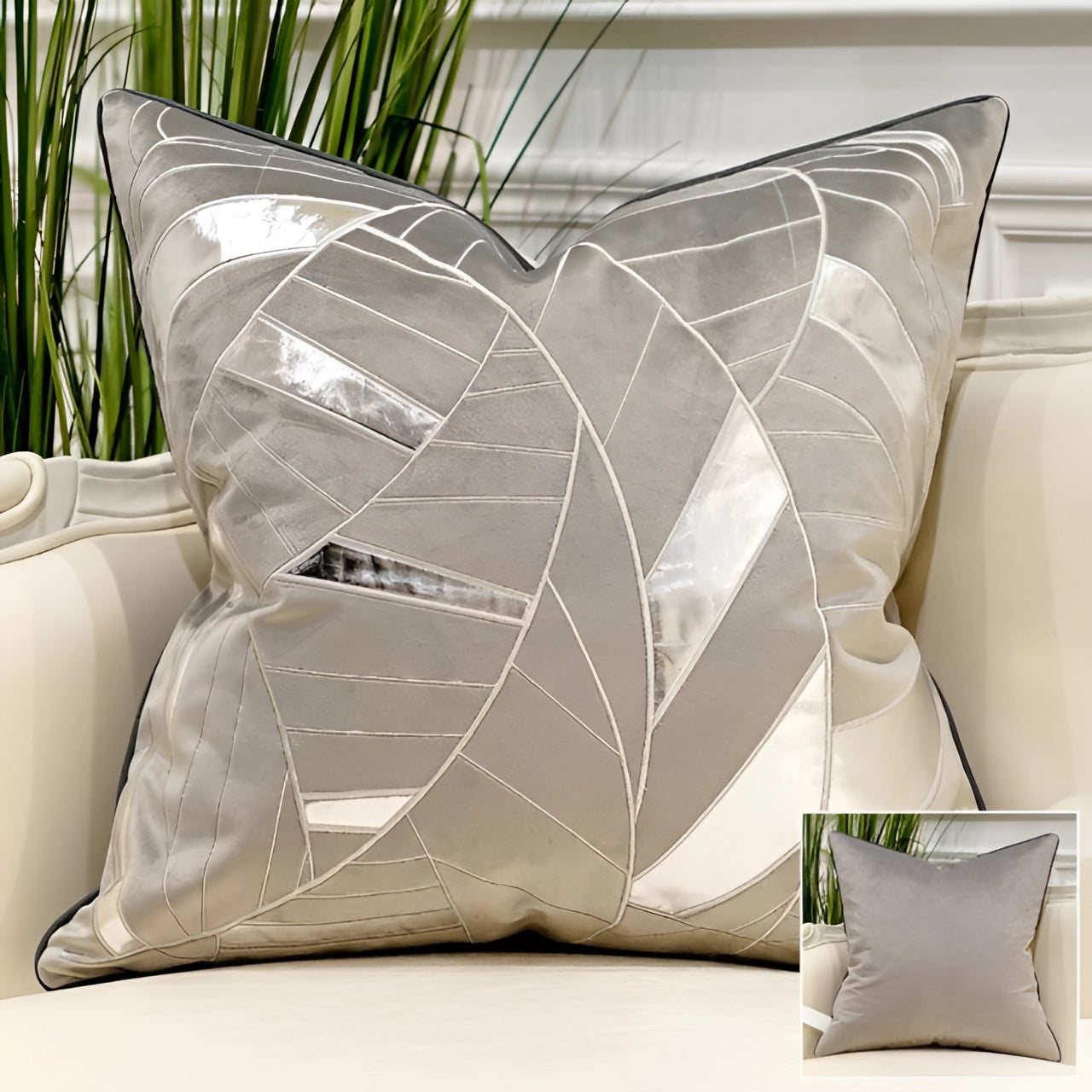 Luxury velvet throw pillow in gray-silver with gold accent geometric decor, featuring an abstract design. The pillow is placed on a couch with a wooden background, adding a touch of elegance and comfort to the living space.