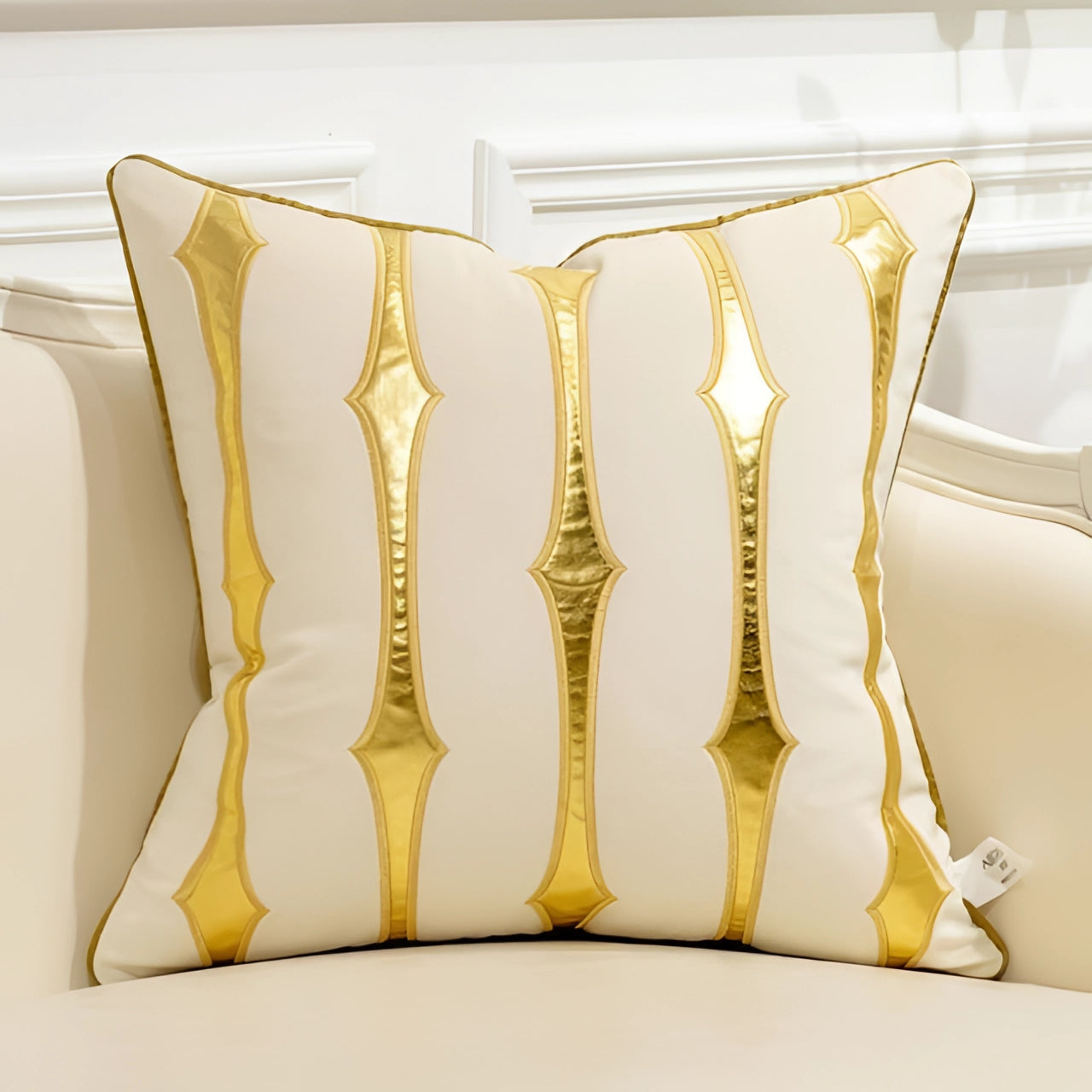 Cream and gold throw pillow cover with a geometric stripe pattern, made from luxurious velvet fabric, sized at 18 inches by 18 inches.