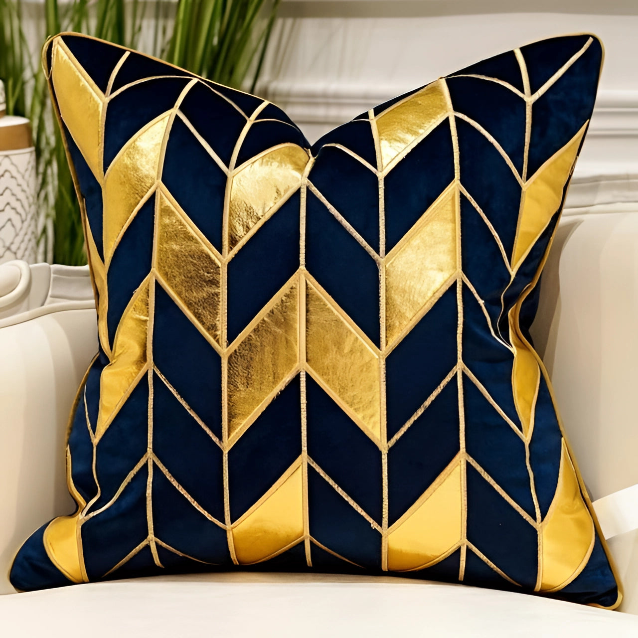 Luxury velvet throw pillow in a 20" x 20" size featuring a blue and gold geometric puzzle pattern, elegantly placed on a couch.