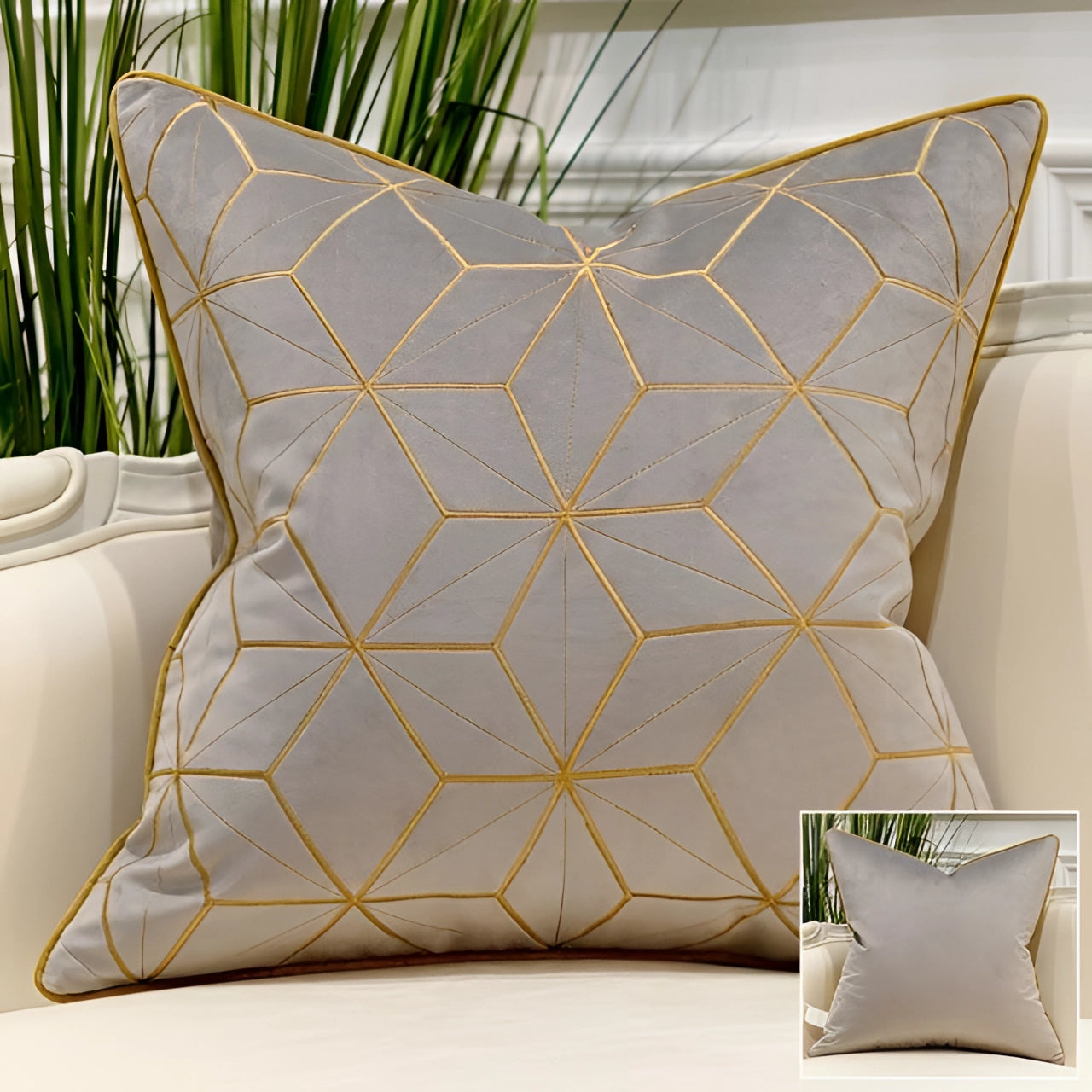 Luxurious gray velvet throw pillow with gold geometric constellation pattern, adding an elegant touch to interior decor.