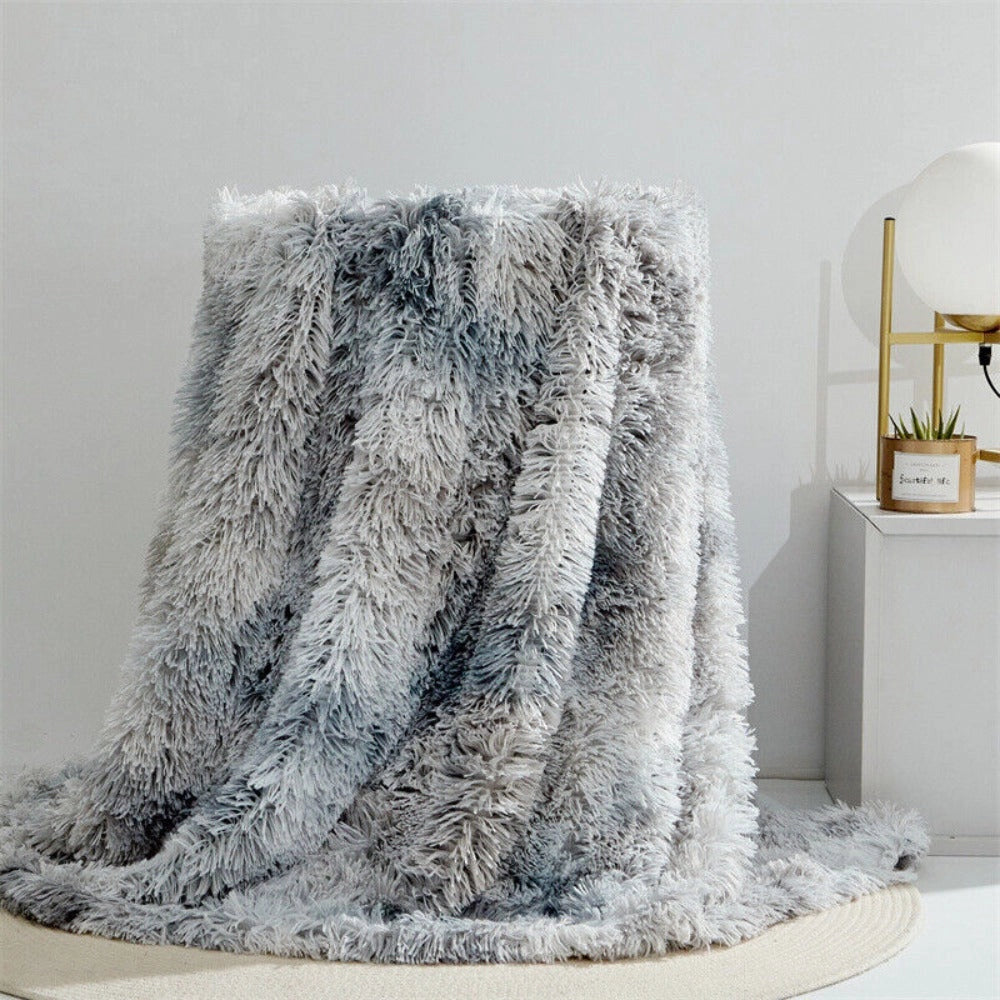 Luxury white faux fur blanket with a textured plush surface, elegantly draped over a surface in a cozy setting, featuring a moonstone color in a 200x300cm size.