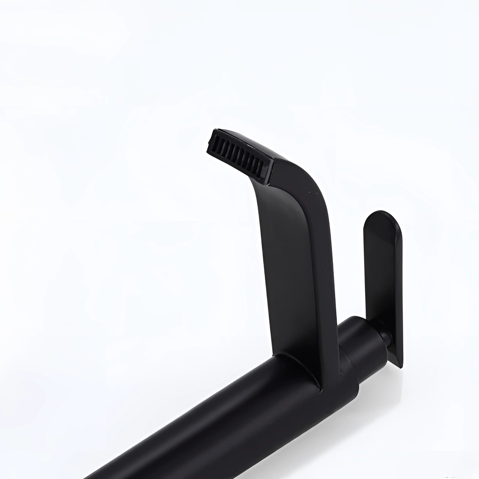 A matte black modern bathroom faucet with a sleek and minimalist design, featuring a rectangular base and smooth finish, suitable for a contemporary sink setting.