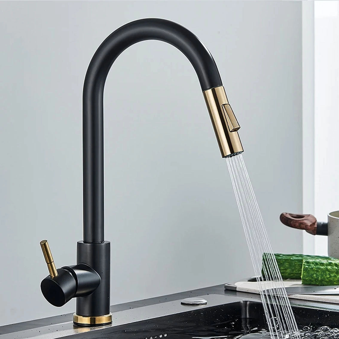 Matte black pull-down kitchen faucet with 360° swivel spout featuring a sleek black gold finish, designed with modern engineering for functional elegance in plumbing fixtures.