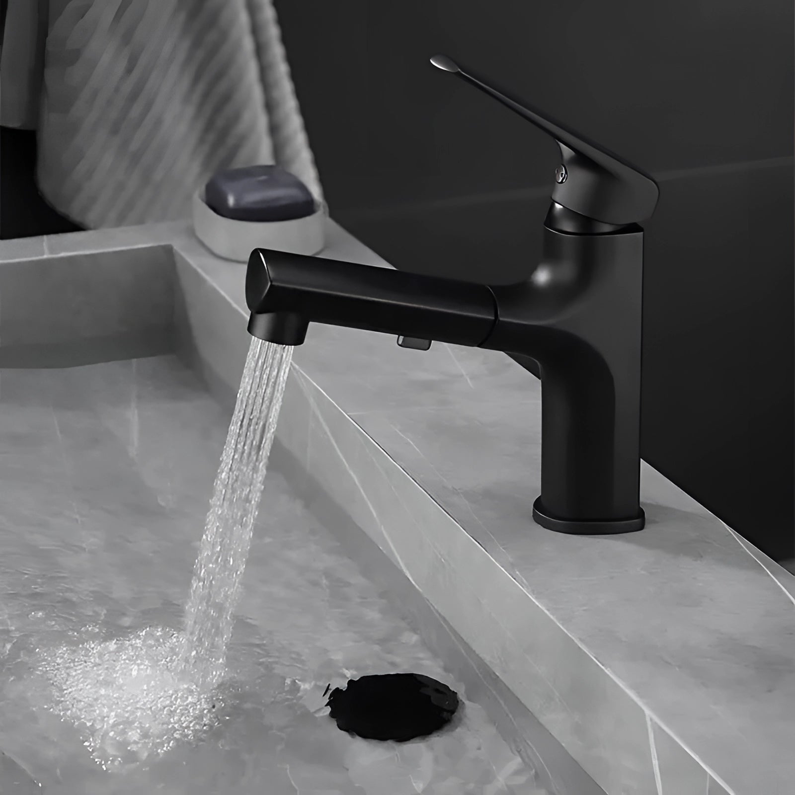 Matte black single-handle bathroom faucet with a modern design, installed on a sink, featuring a sleek and water-efficient tap for household plumbing use.