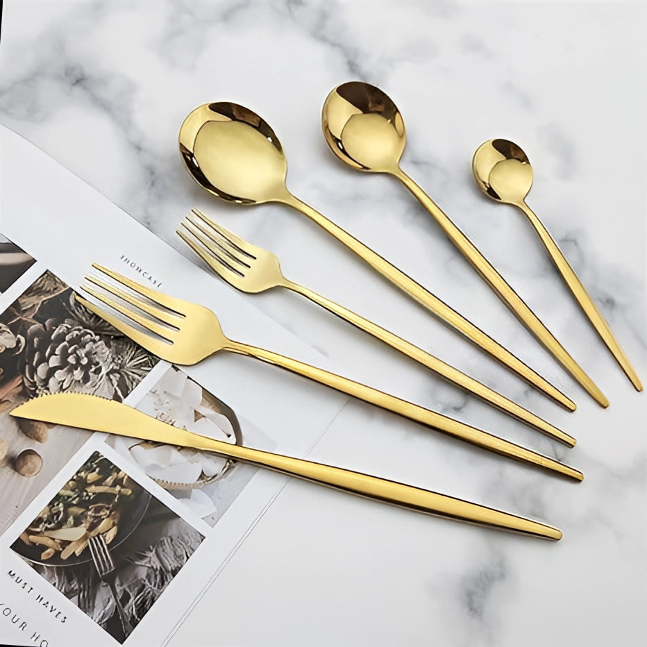 Matte black stainless steel cutlery set featuring a modern minimalist design, displayed on a tabletop with a sleek, contemporary aesthetic.