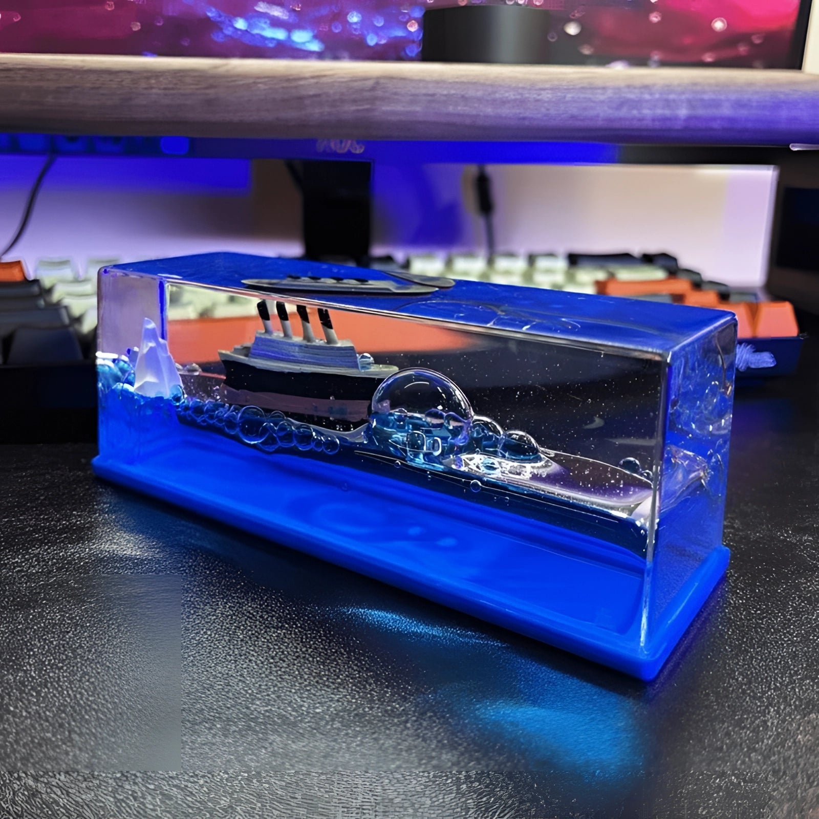 Miniature ship encased in a clear acrylic wave, designed as nautical decor and a unique sea-themed gift.