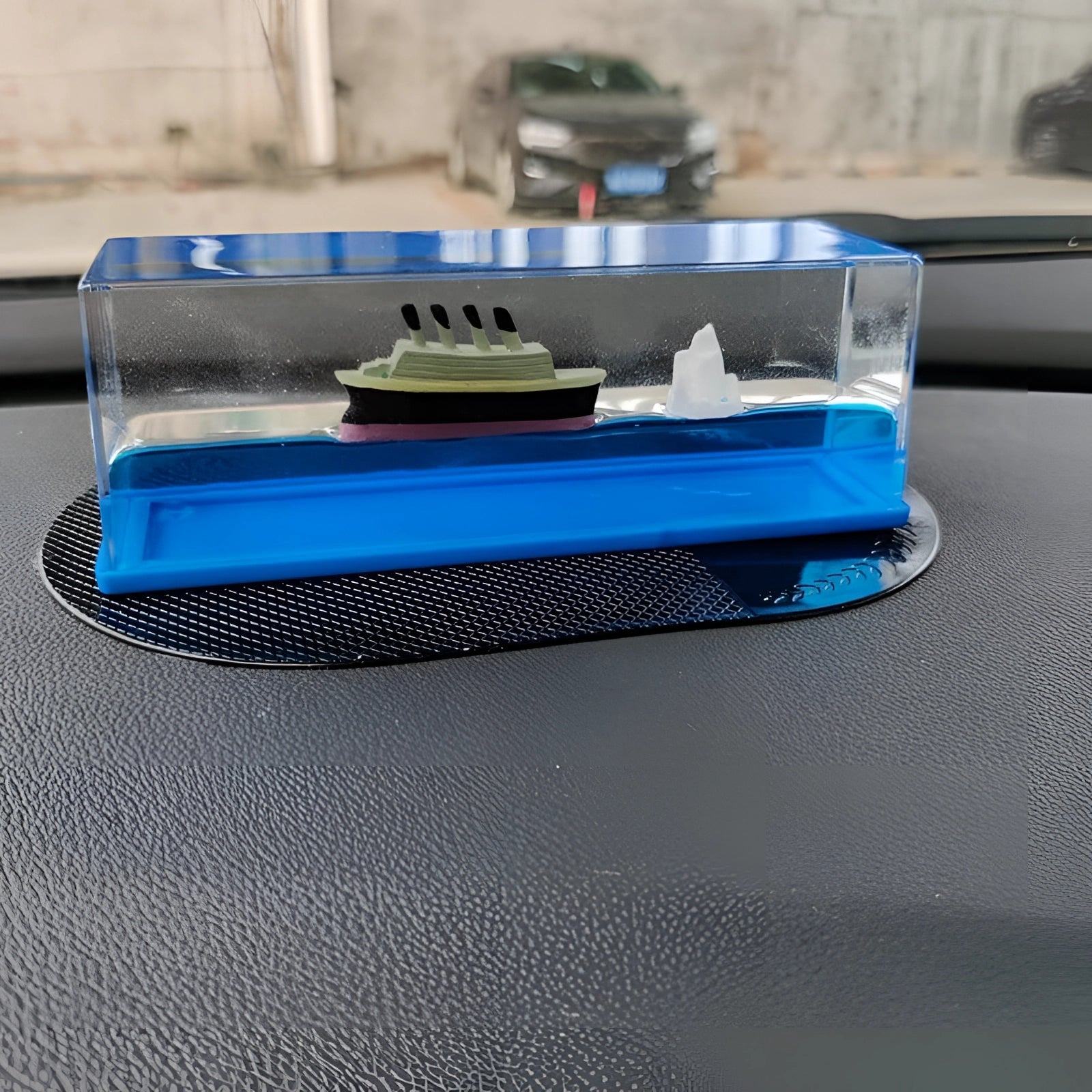 A miniature ship encased in a clear acrylic wave, designed as a nautical decor piece and sea-themed gift.