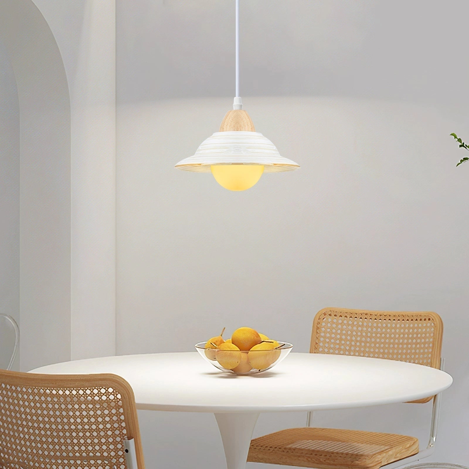 Minimalist Scandinavian wooden pendant light hanging above a Nordic dining table, featuring a sleek wooden design, warm lighting, and modern interior decor with wooden furniture.