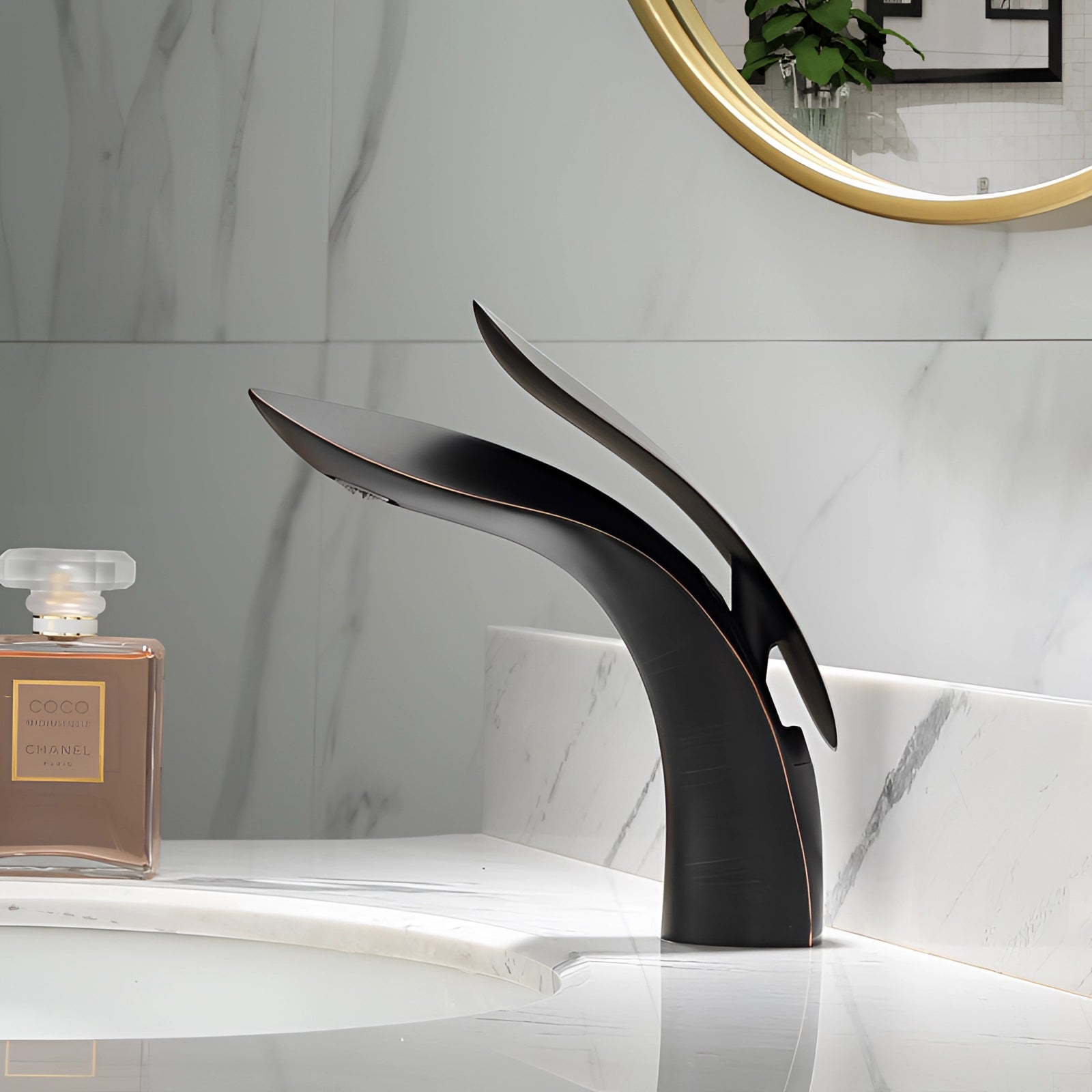 Modern black designer kitchen faucet with a sleek, minimalist design set against a stylish interior background featuring white walls and subtle plant accents.