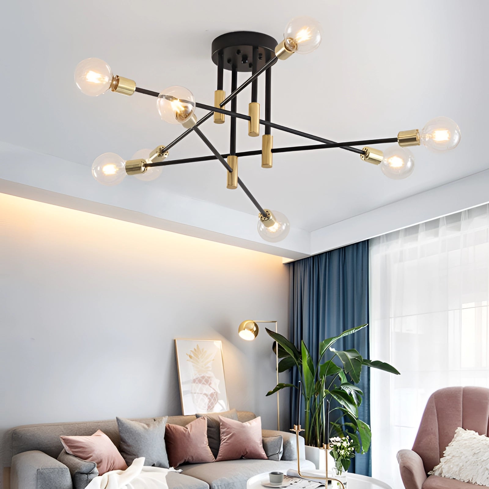 Modern black and gold mid-century adjustable glass chandelier with 8 clear warm light bulbs, hanging from a ceiling in a stylish interior with wooden accents and green plants.