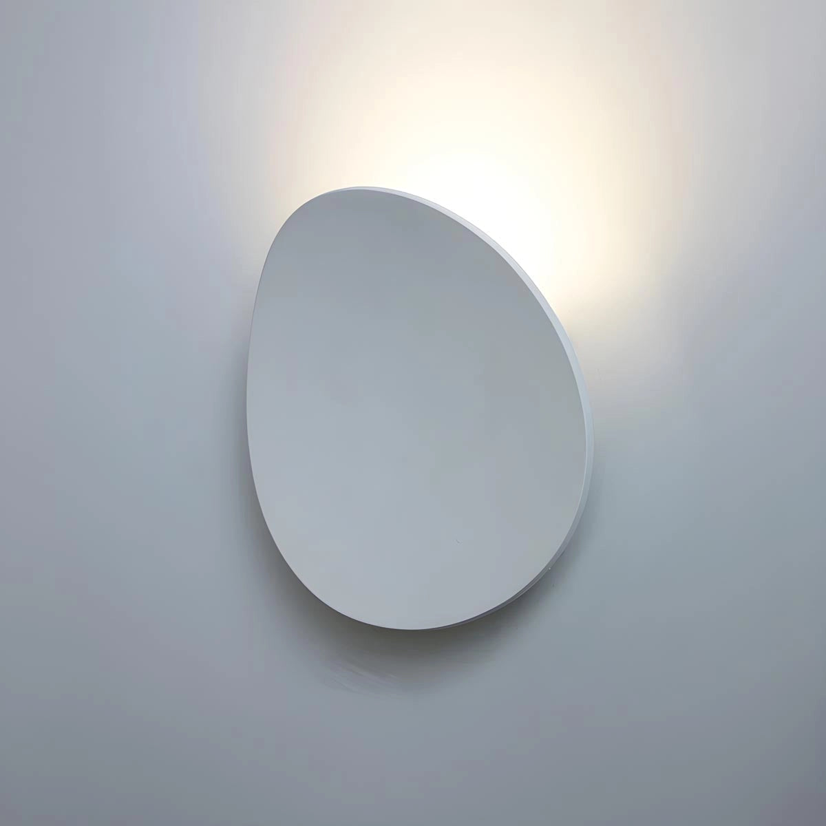 Modern white LED wall light with a minimalist design, featuring a cylindrical metal shade and circular light fixture.