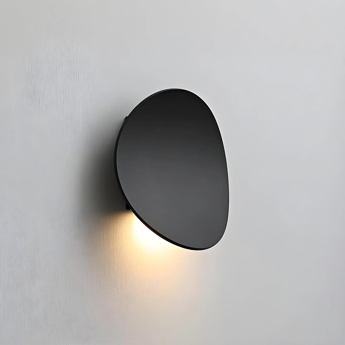 Modern black LED wall light with a contemporary minimalist design, featuring a cylindrical metal sconce.