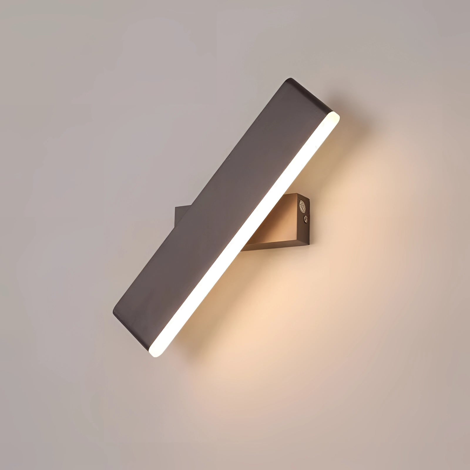 Modern black LED wall sconce with a minimalist geometric design, featuring a rectangular shape made from composite materials including metal and aluminum, mounted on a wall.