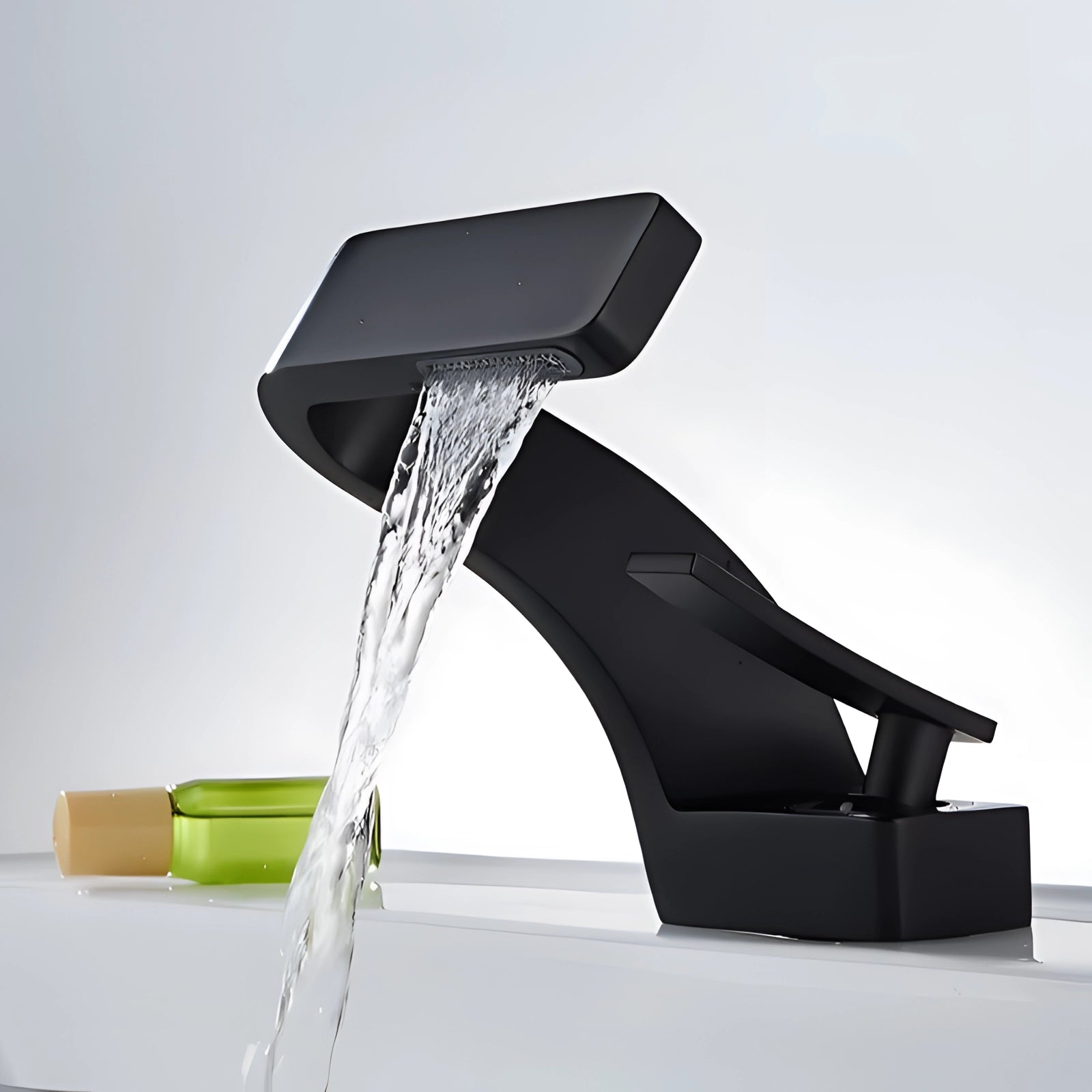 Sleek black single-handle modern chrome waterfall bathroom faucet with a minimalist design, featuring a rectangular-shaped spout against a plain background.