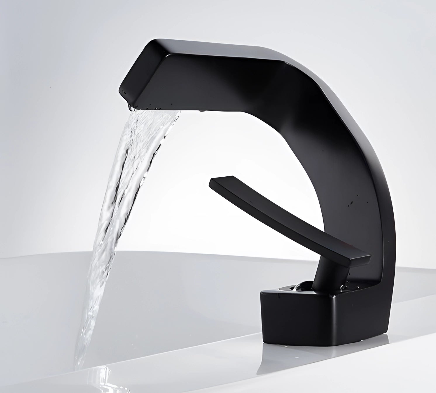 Modern chrome waterfall faucet with a sleek, luxury square spout design, suited for a contemporary bathroom basin mixer.