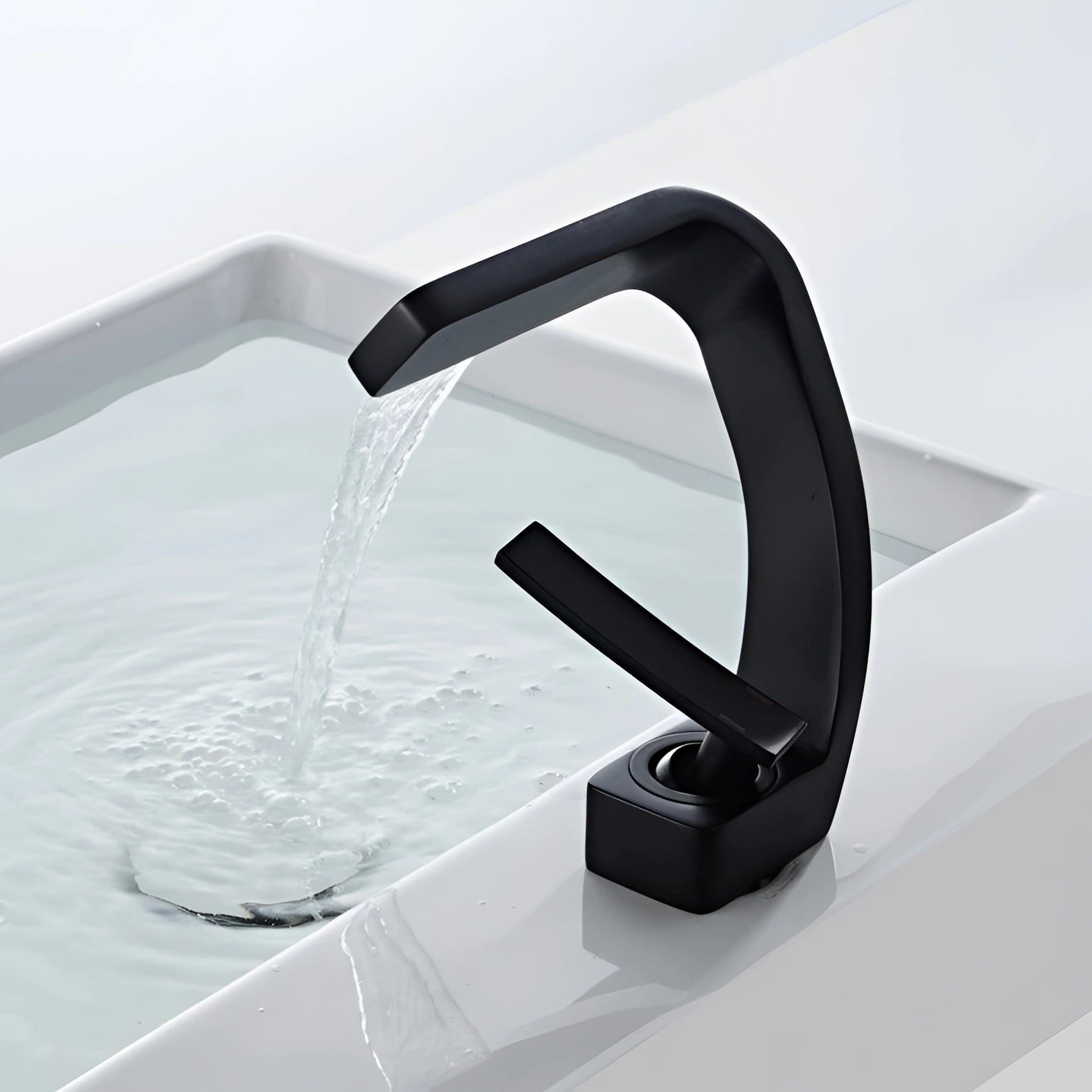 Modern chrome waterfall faucet with a luxury square spout, elegantly designed for basin mixers, showcasing a sleek, reflective finish and smooth water flow.