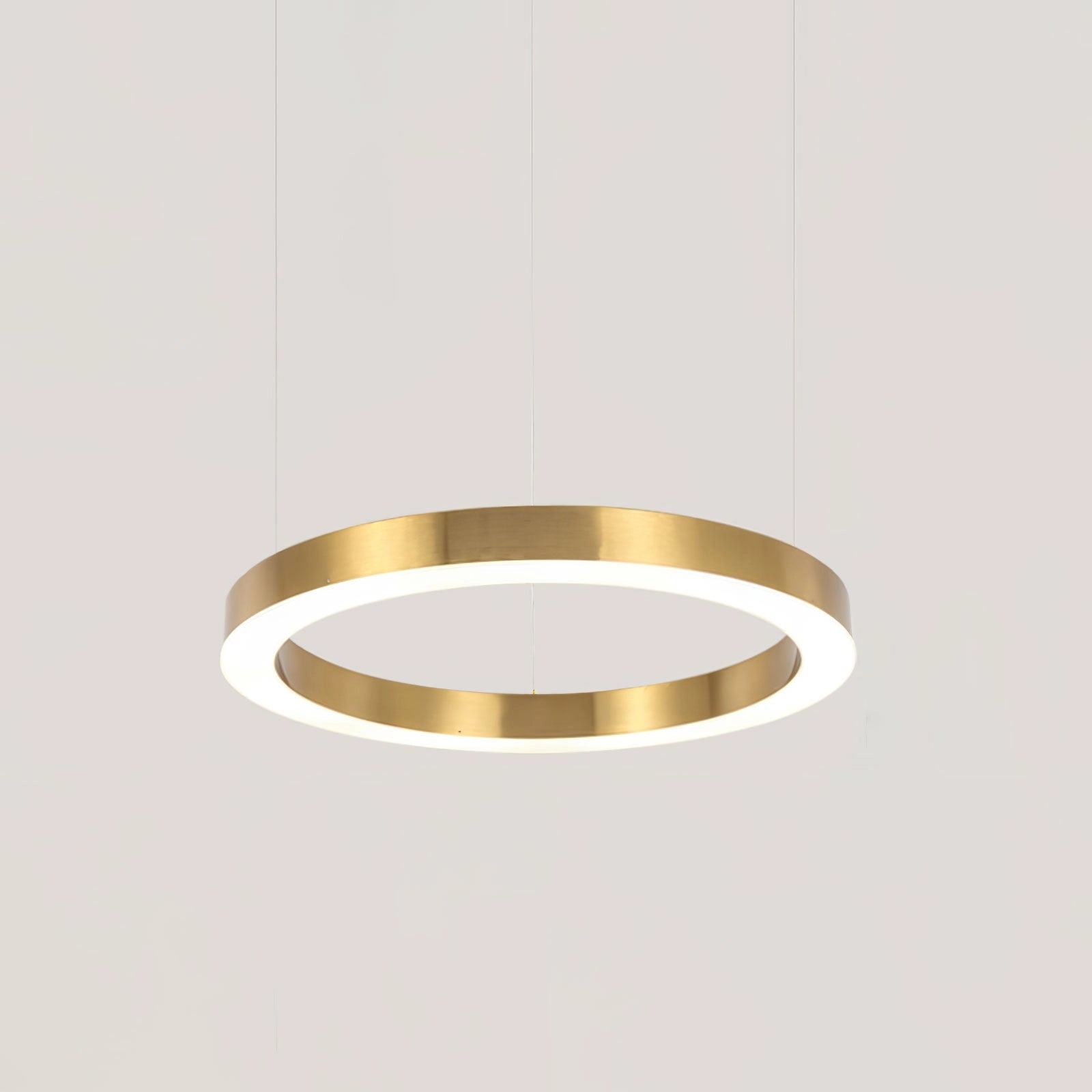 Modern circular LED ring pendant light with a diameter of 60 cm, featuring a sleek metal design perfect for luxury hotel lobbies, emitting cool light. The pendant light is suspended and has a minimalist, contemporary aesthetic with a smooth, metallic finish.