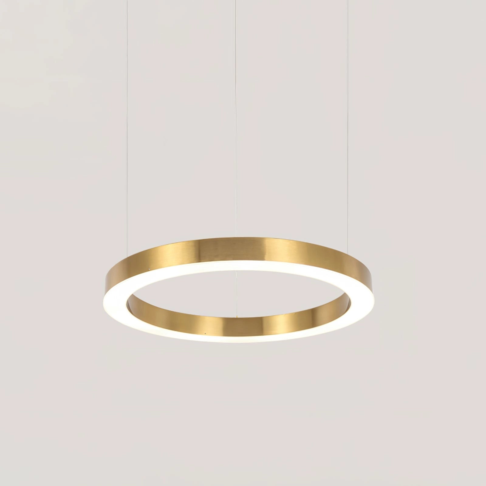 Modern circular LED ring pendant light with a sleek metal finish, designed for luxury hotel lobby lighting.