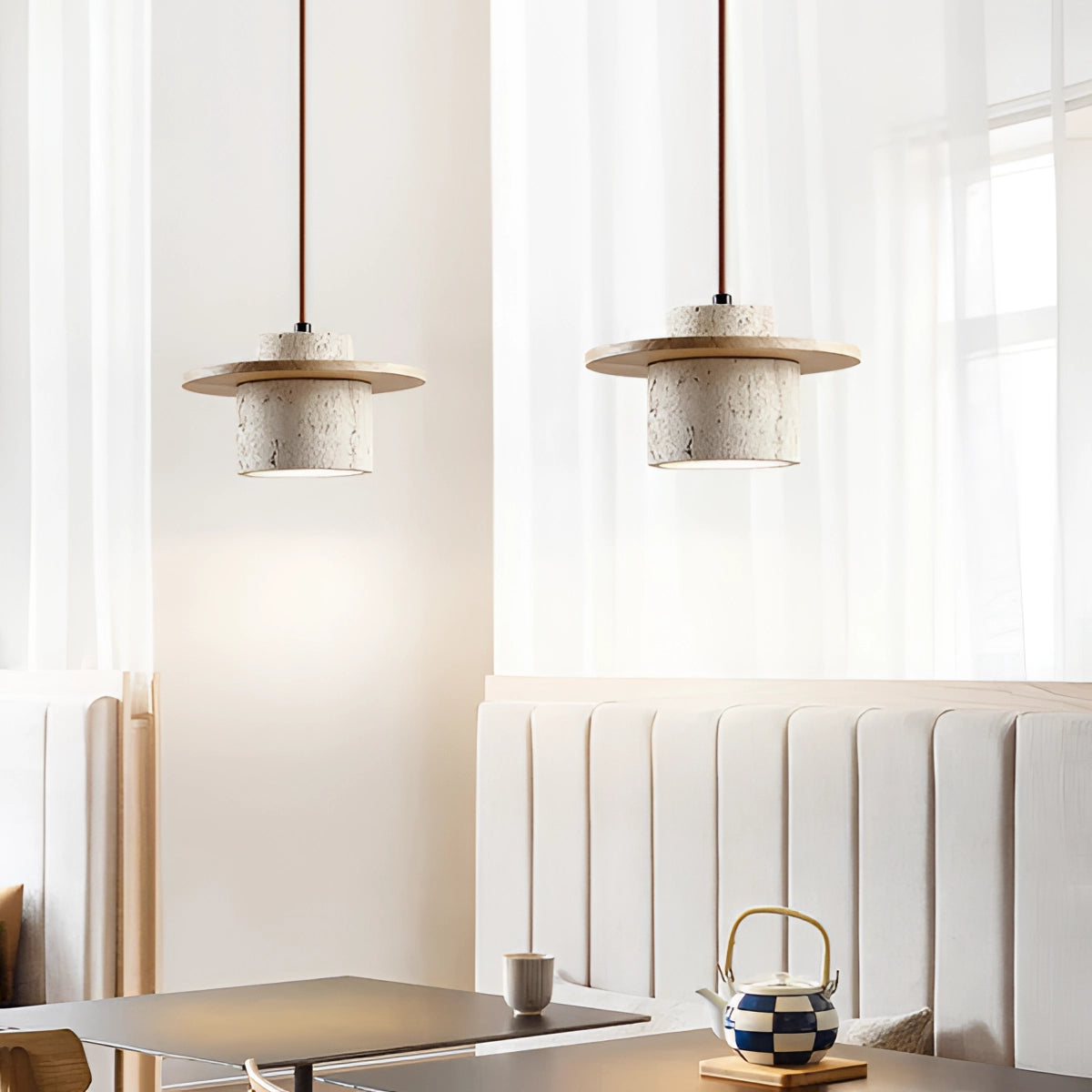 Modern concrete pendant light with oak wood accents hanging from the ceiling, designed for Scandinavian interior decor, illuminating a space with its sleek and minimalistic style.