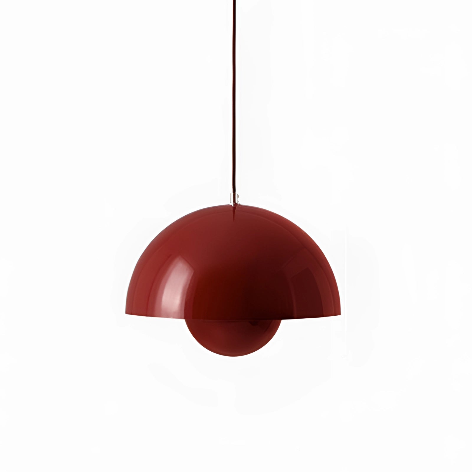 Modern copper pendant light with a Scandinavian minimalist design in red, hanging from the ceiling. The light fixture features a sleek, circular shape with carmine accents, creating a simple yet elegant atmosphere.