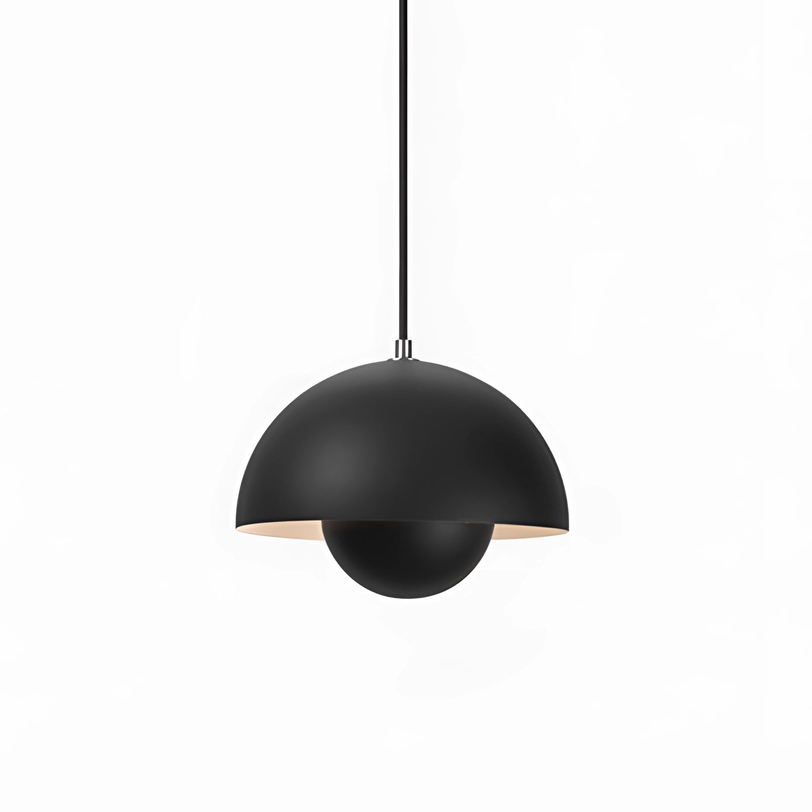 Modern black copper pendant light with a Scandinavian minimalist design, hanging from the ceiling over a table, emphasizing sleek lines and simplicity.