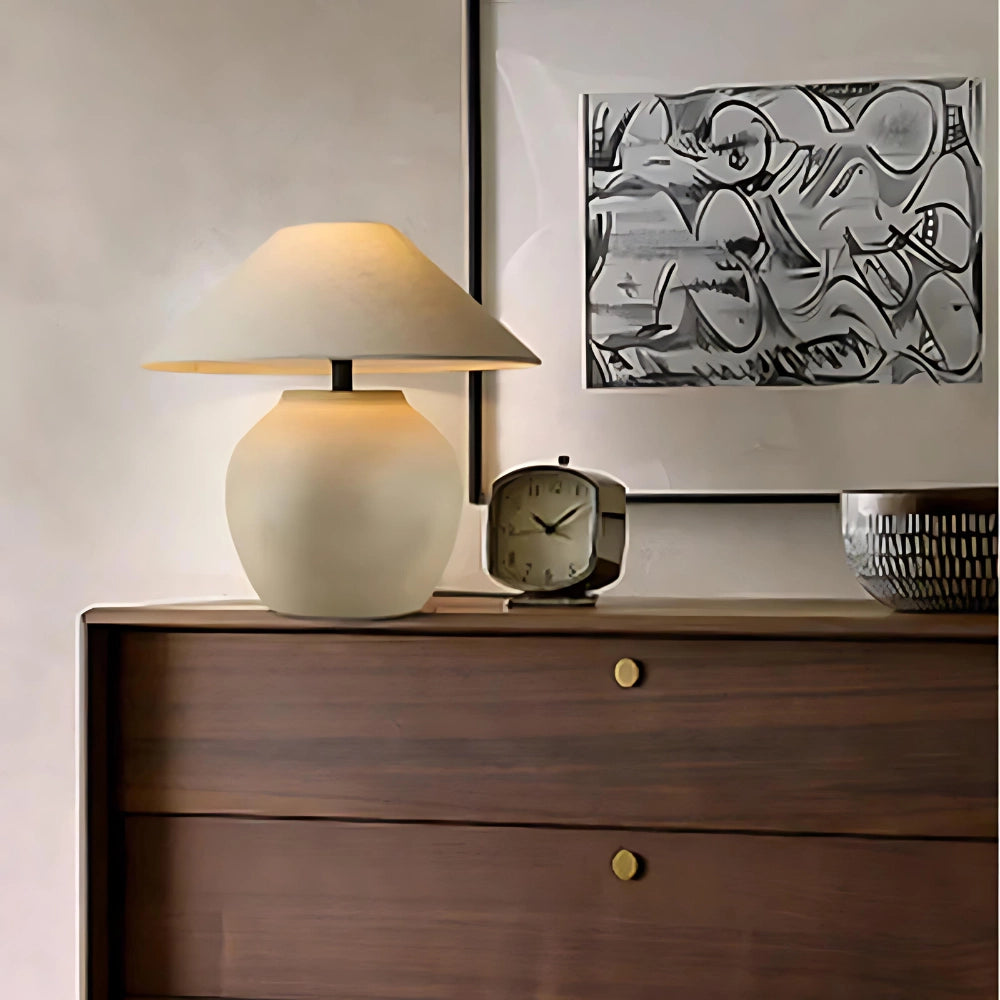 Modern dark wood bedside table featuring a minimalist design with a rectangular shape, a drawer, and a lower shelf, placed in a room with a grey interior design.