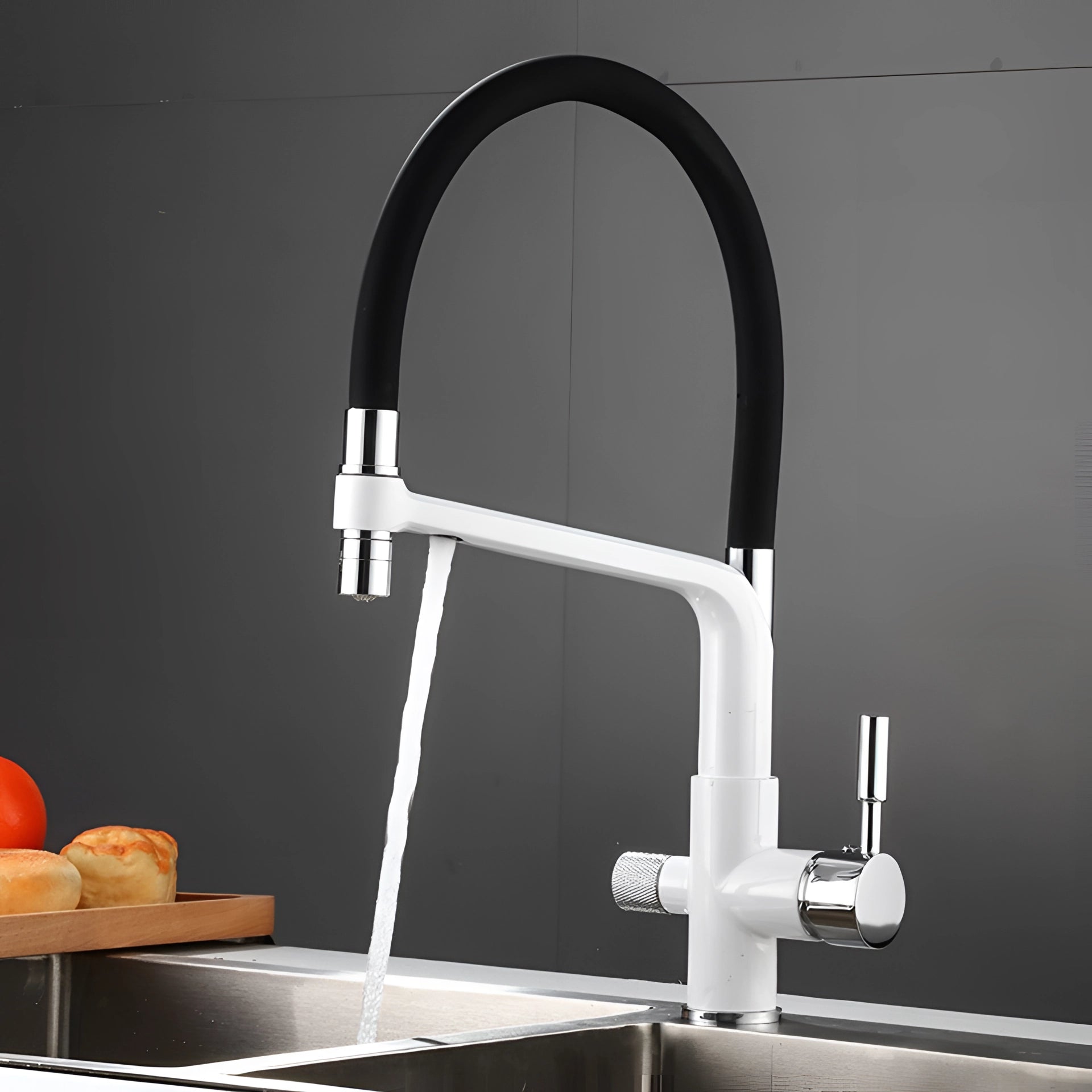 Sleek black and chrome pull-down kitchen faucet with a modern design, featuring a dual-function spray head and a sturdy rectangular base, set atop a white kitchen counter.