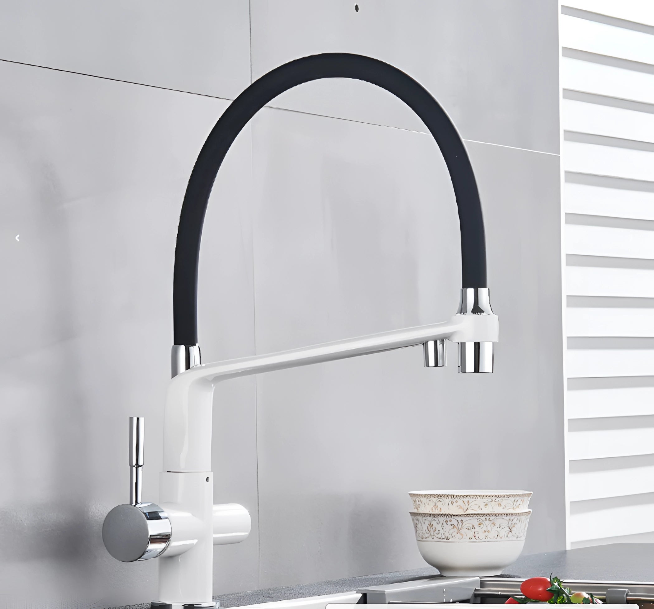 Modern dual-function pull-down kitchen faucet in black and chrome finish, featuring a sleek rectangular handle and contemporary design, set against a white background.