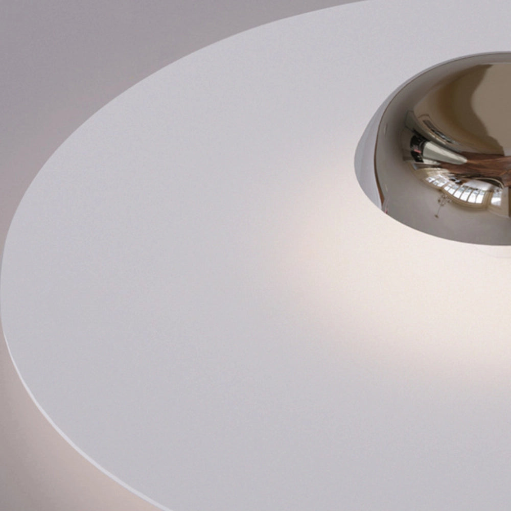 Modern flush mount ceiling light with a sleek minimalist round design, attached to the ceiling, providing an elegant lighting solution for modern interiors.