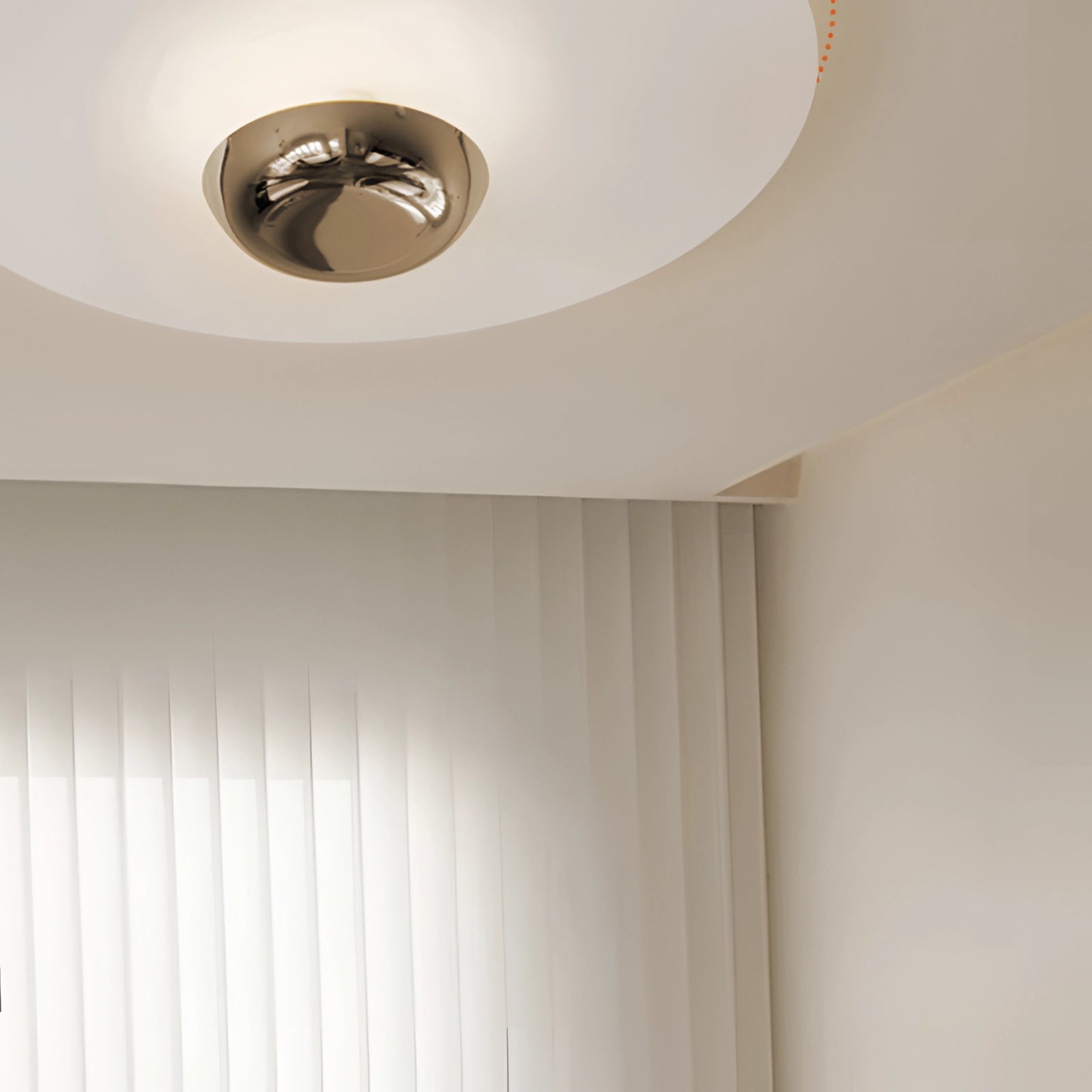 Modern round flush mount ceiling light with a sleek minimalist design, featuring a beige wooden shade, mounted on a plaster ceiling with decorative molding, complementing contemporary interior design aesthetics.