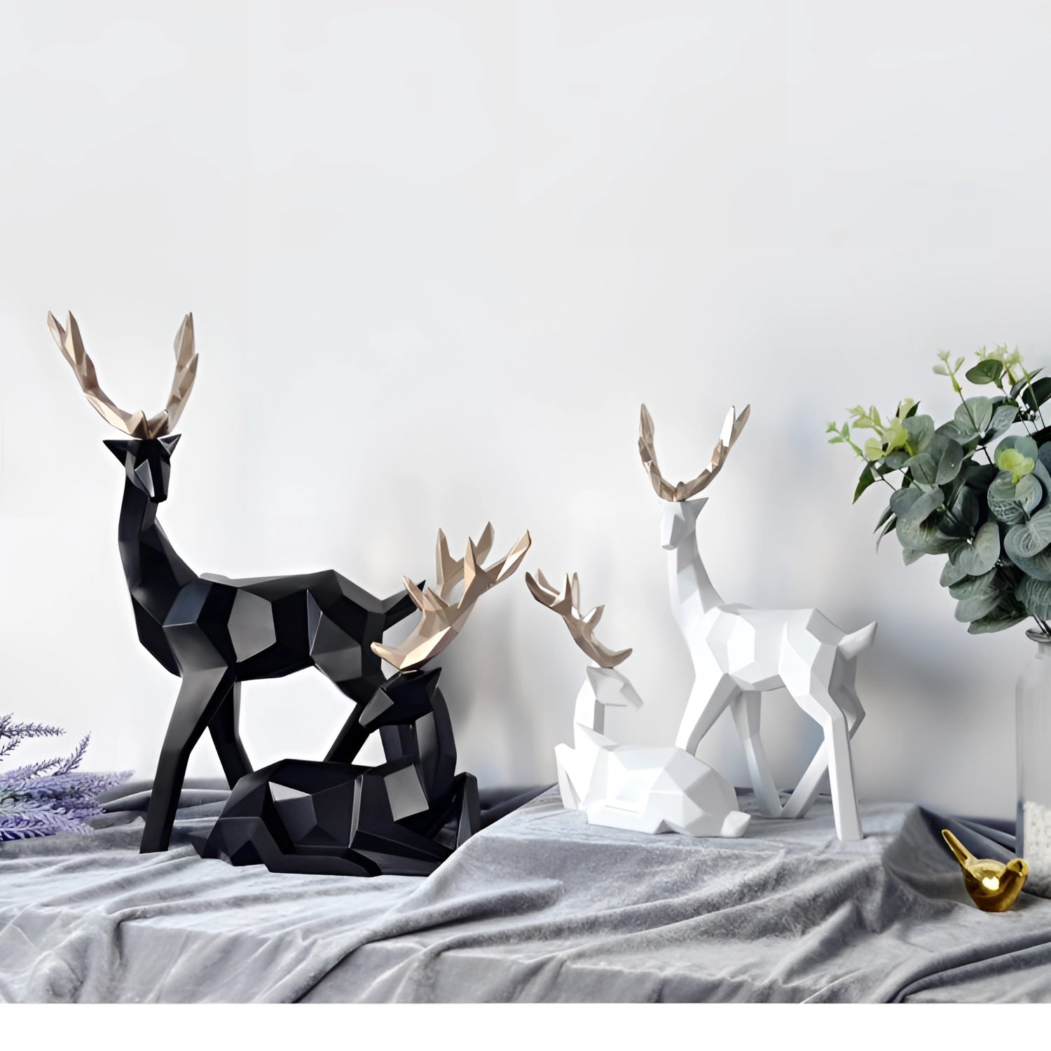 Minimalist black and white geometric deer sculpture with defined antlers, showcasing modern art design elements suitable for contemporary decor.