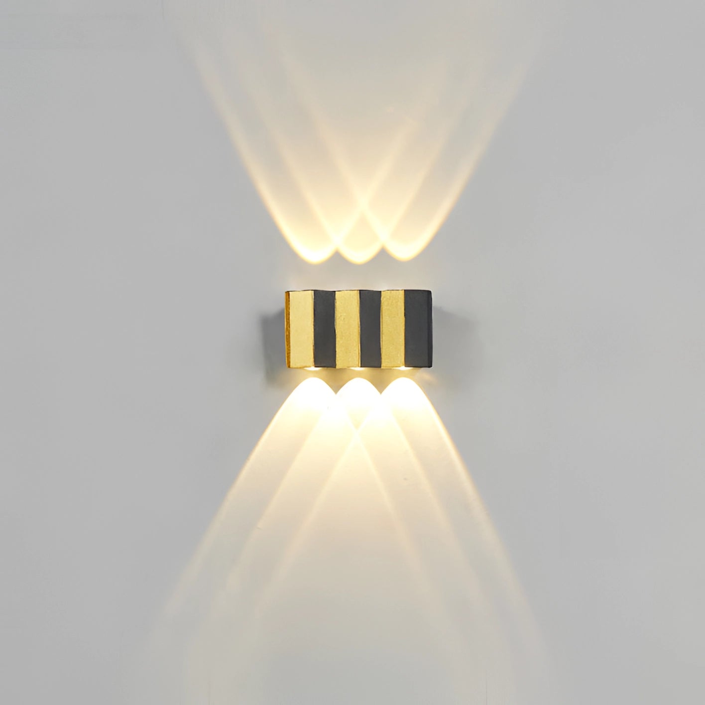 Modern geometric LED wall lamp with a circular design, featuring a symmetrical metal structure and a waterproof finish, suitable for outdoor use as a light fixture.